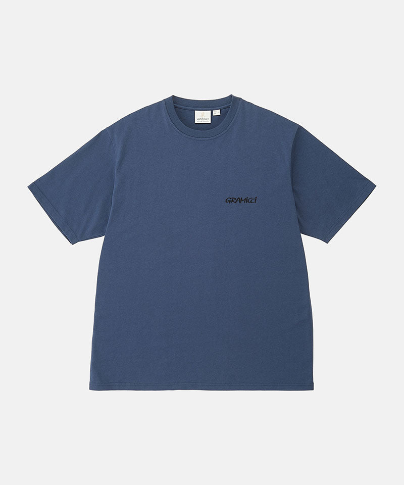 Gramicci navy Bass Tee against a light-tone background.