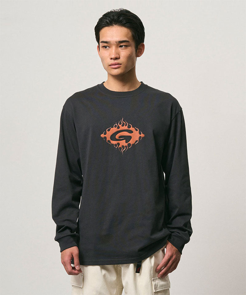 Model wearing a Gramicci vintage black Flames Long Sleeve Tee with a graphic against a light-tone background.