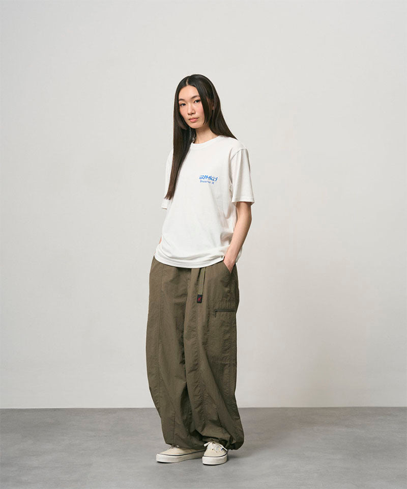 Back view of a Gramicci ash heather Earth Tee with a graphic against a light-tone background.