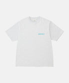Gramicci ash heather color Joker Tee against a light-tone background.