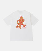 Back view of a Gramicci white Joker Tee with an orange graphic against a light-tone background.