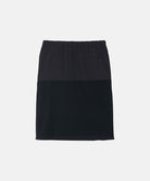 Back view of a black Gramicci Thermal Fleece Skirt against a light-tone background.