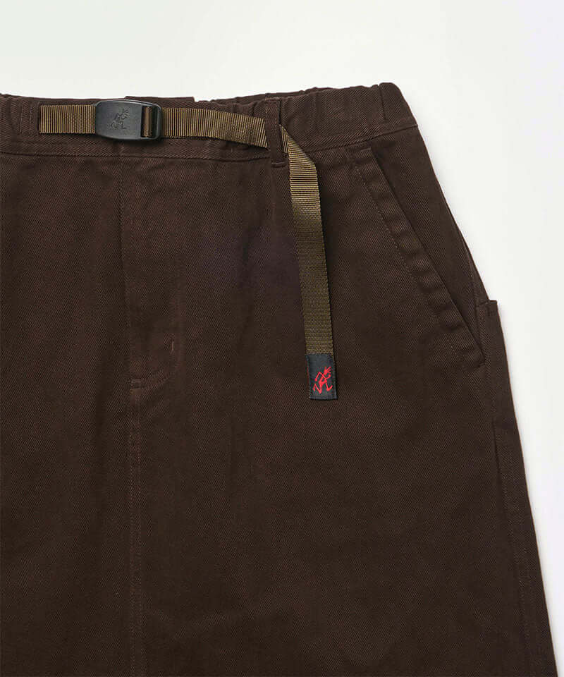 Close-up view of a coffee colored Gramicci Venture Skirt against a light-tone background.