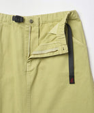 Close-up of the waistband on a elm pigment colored Gramicci Gramicci 5-Pocket Skirt on a light-tone background.