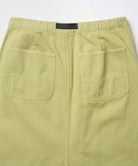 Back view close-up of a elm pigment colored Gramicci 5-Pocket Skirt against a light-tone background.