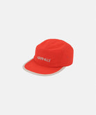 Orange Nylon Gramicci Cap against a light-tone background.