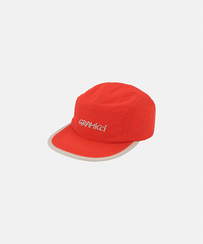 Orange Nylon Gramicci Cap against a light-tone background.