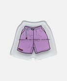 Small tray with purple Gramicci shorts with a belt against a light-tone background
