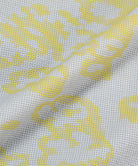 Gramicci yellow and grey grid camo Flyweight Vest fabric swatch.