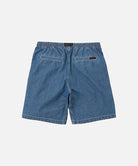 Back view of blue Gramicci Japanese Chambray Shorts on a light-tone background.