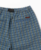 Back view close-up of the blue multistripe Gramicci Gramicci O.G. G-Short Seersucker Plaid on a light-tone background.
