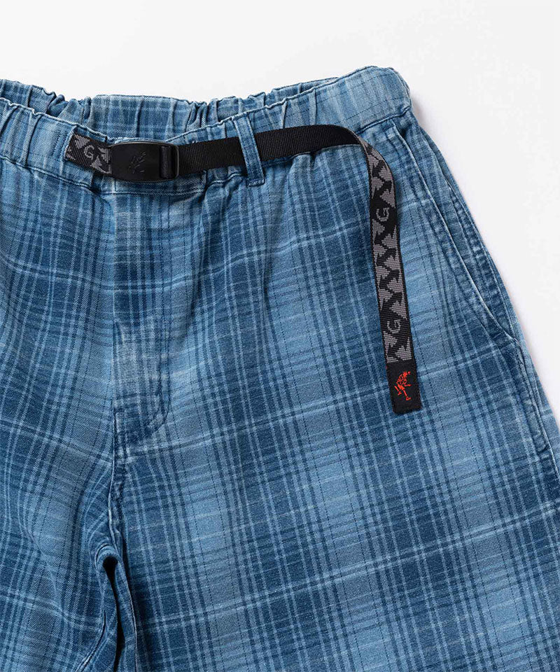 Close-up of a indego Gramicci Lagoon Short Denim Plaid on a light-tone background.