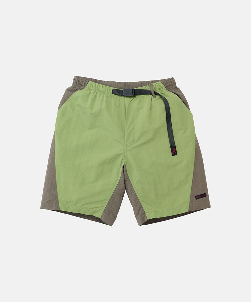 Jade green Gramicci Nylon Block Shorts with a belt against a light-tone background.