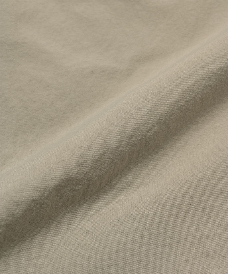 Milk tea colored colored Gramicci Nylon Cliff Short fabric swatch.