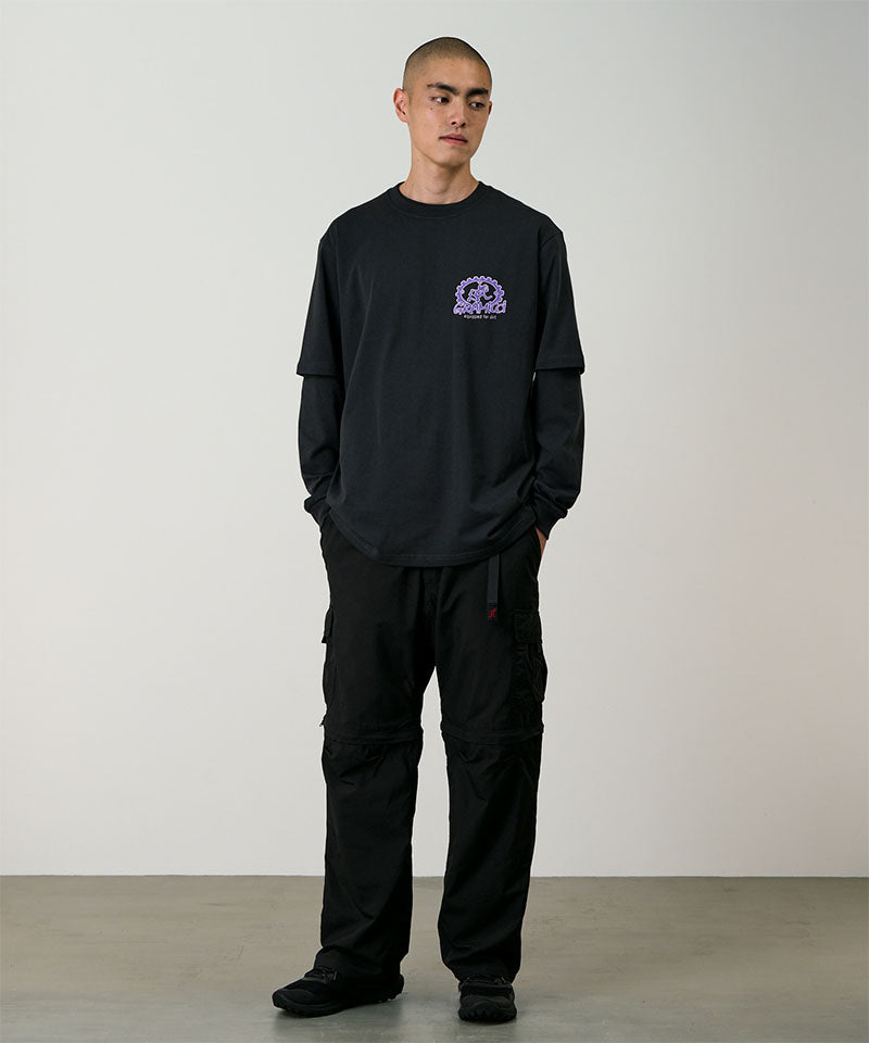 Model wearing black Gramicci Convertible Cargo Pants and a black shirt on a light-tone background.