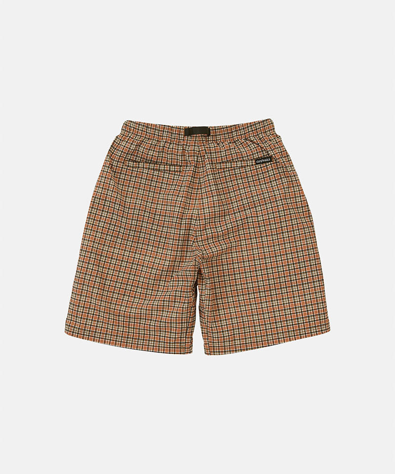 Back view of brick check colored Gramicci Checkered Shell Shorts on a light-tone background.