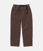 Gramicci Milton Pants in walnut with a black belt against a light-tone background.