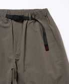 Close-up view of granite colored Gramicci Nylon Paneled Trek Pants on a light-tone background.