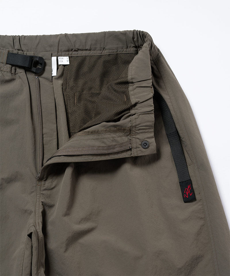 Close-up view of granite colored Gramicci Nylon Paneled Trek Pants on a light-tone background.