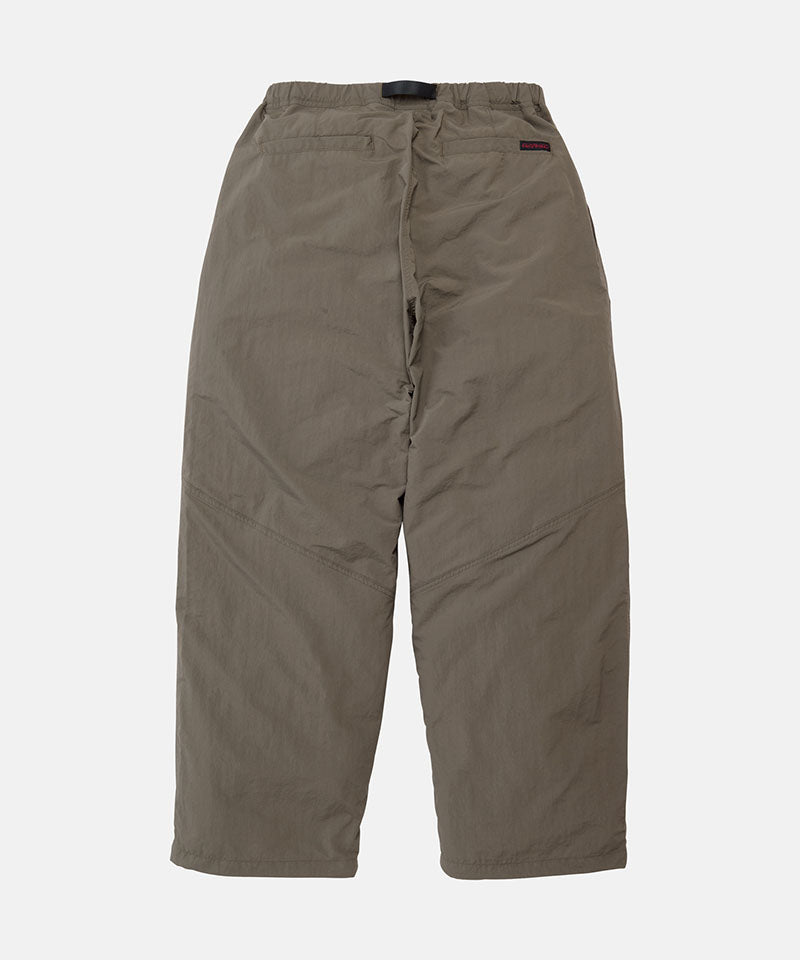 Back view of granite colored Gramicci Nylon Paneled Trek Pants on a light-tone background.