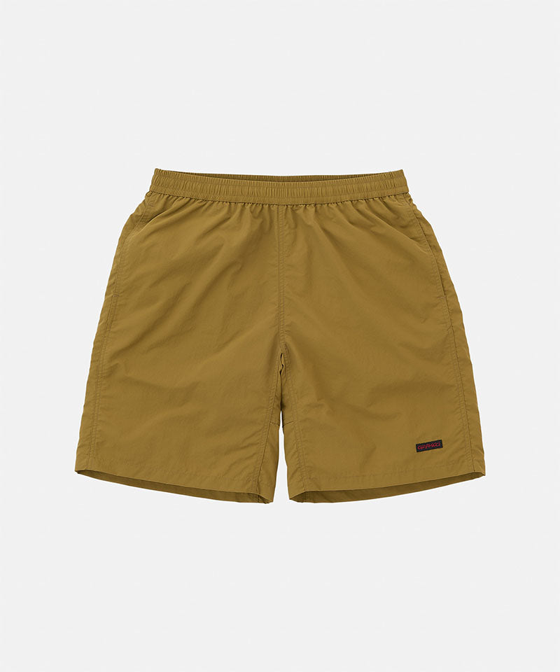 Artichoke colored Gramicci Nylon Reef Shorts against a light-tone background.