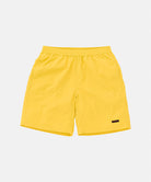 Banana colored Gramicci Nylon Reef Short against a light-tone background.
