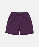 Deep purple Gramicci Nylon Reef Shorts against a light-tone background.