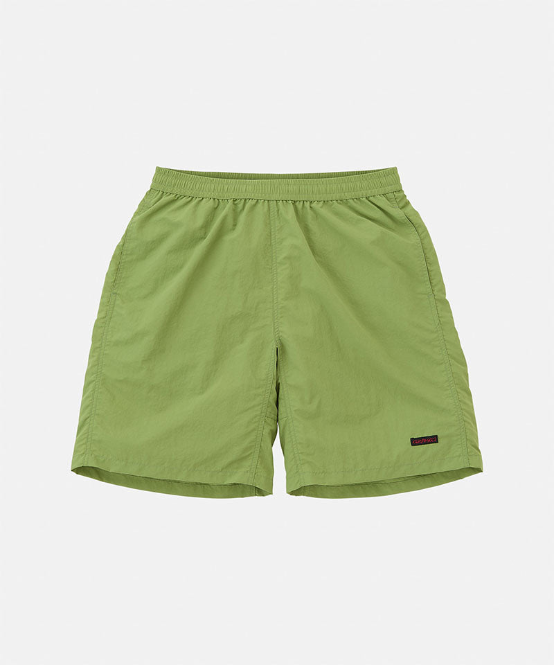 Jade green Gramicci Nylon Reef Shorts against a light-tone background.