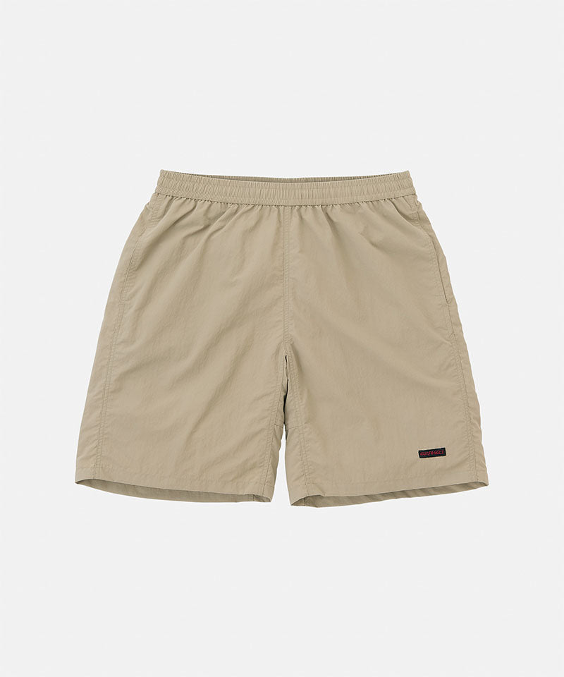 Milk tea colored Gramicci Nylon Reef Shorts against a light-tone background.
