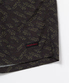 Brown leaf colored Gramicci Nylon Packable G-Short hem showing the logo label on a light-tone background.