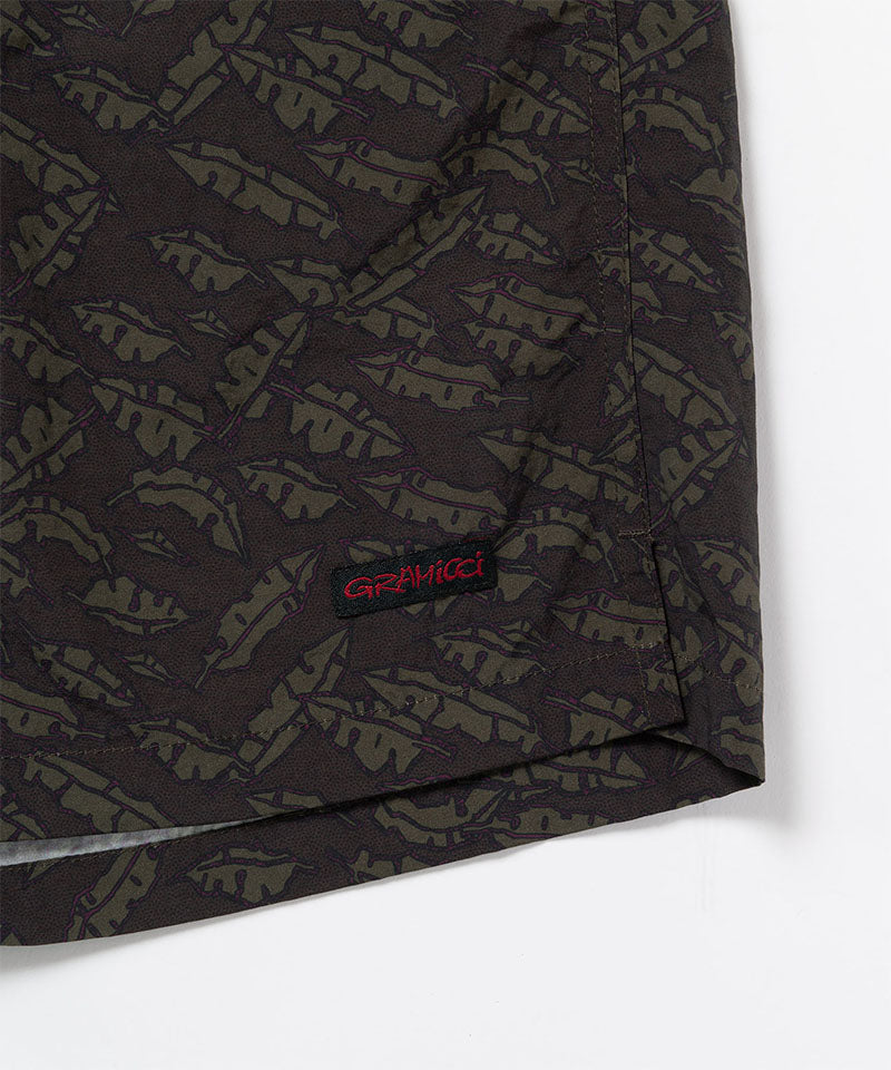 Brown leaf colored Gramicci Nylon Packable G-Short hem showing the logo label on a light-tone background.