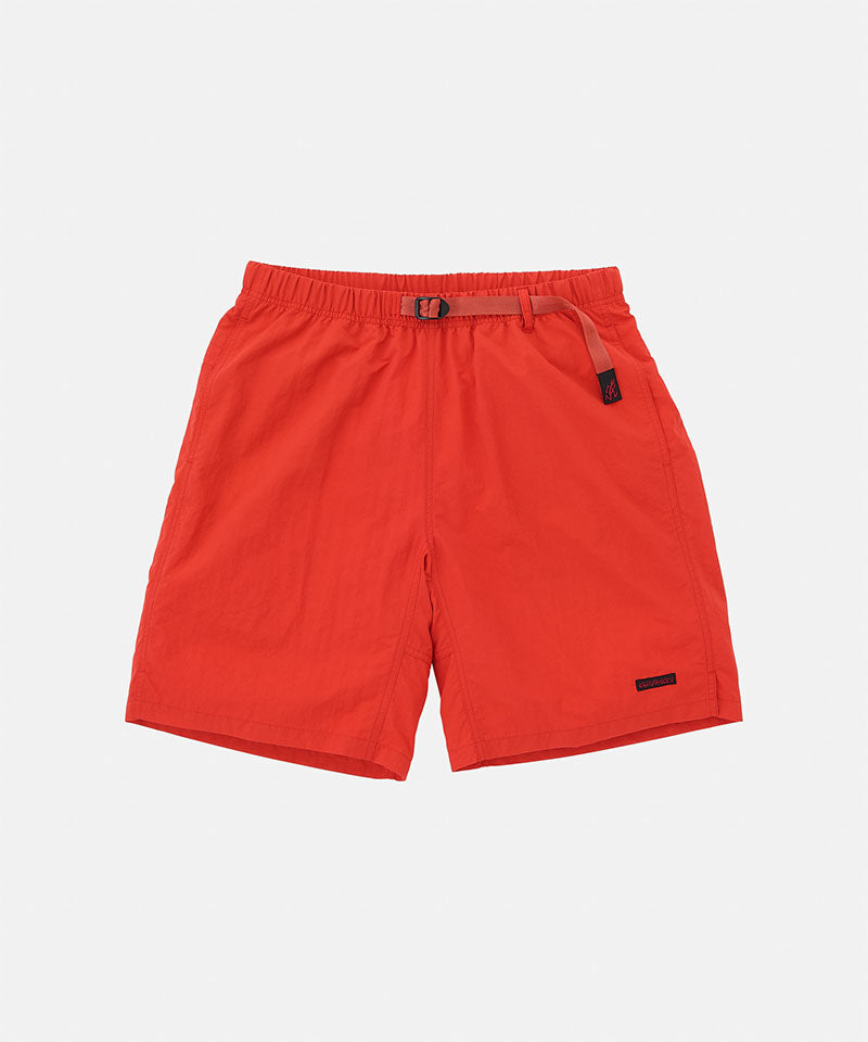 Burnt orange Gramicci Nylon Packable G-Shorts with a belt against a light-tone background.
