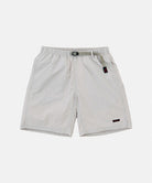 Ecru colored Gramicci Nylon Packable G-Shorts with a belt against a light-tone background.