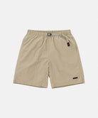 Milk tea colored Gramicci Nylon Packable G-Shorts with a belt against a light-tone background.