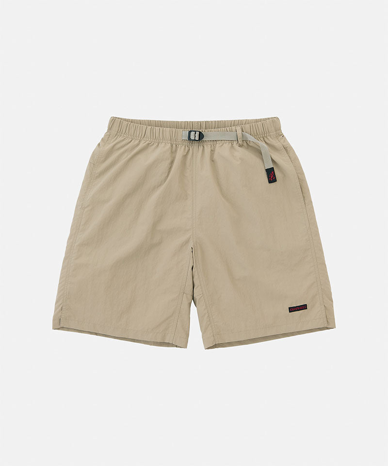 Milk tea colored Gramicci Nylon Packable G-Shorts with a belt against a light-tone background.