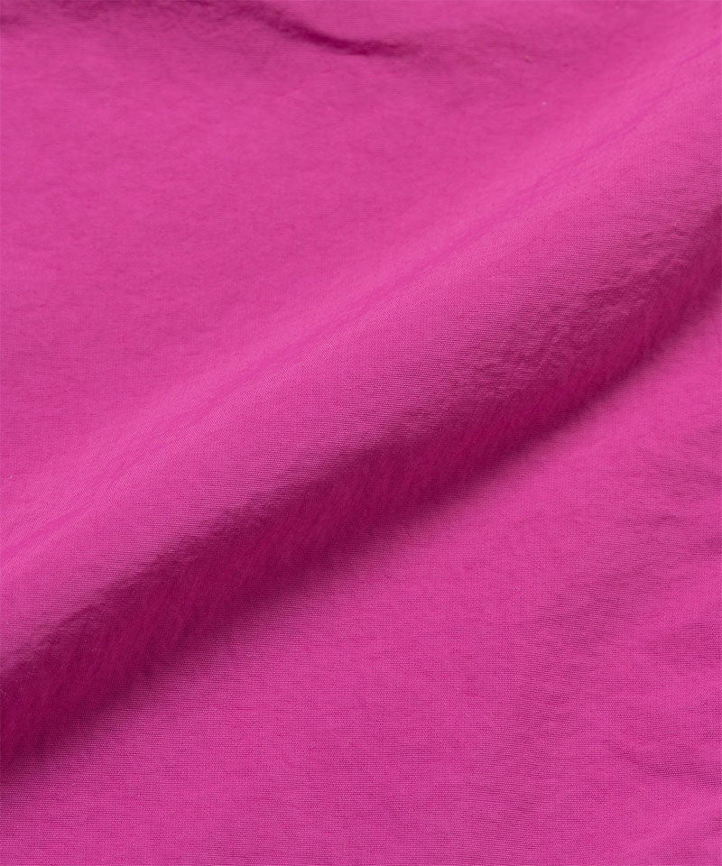 Bright plum colored colored Gramicci Nylon Packable G-Short fabric swatch.