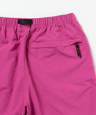 Back view close-up of bright plum colored Gramicci Nylon Packable G-Short on a light-tone background.