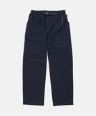 Double navy Gramicci EQT Pant with a belt against a light-tone background.