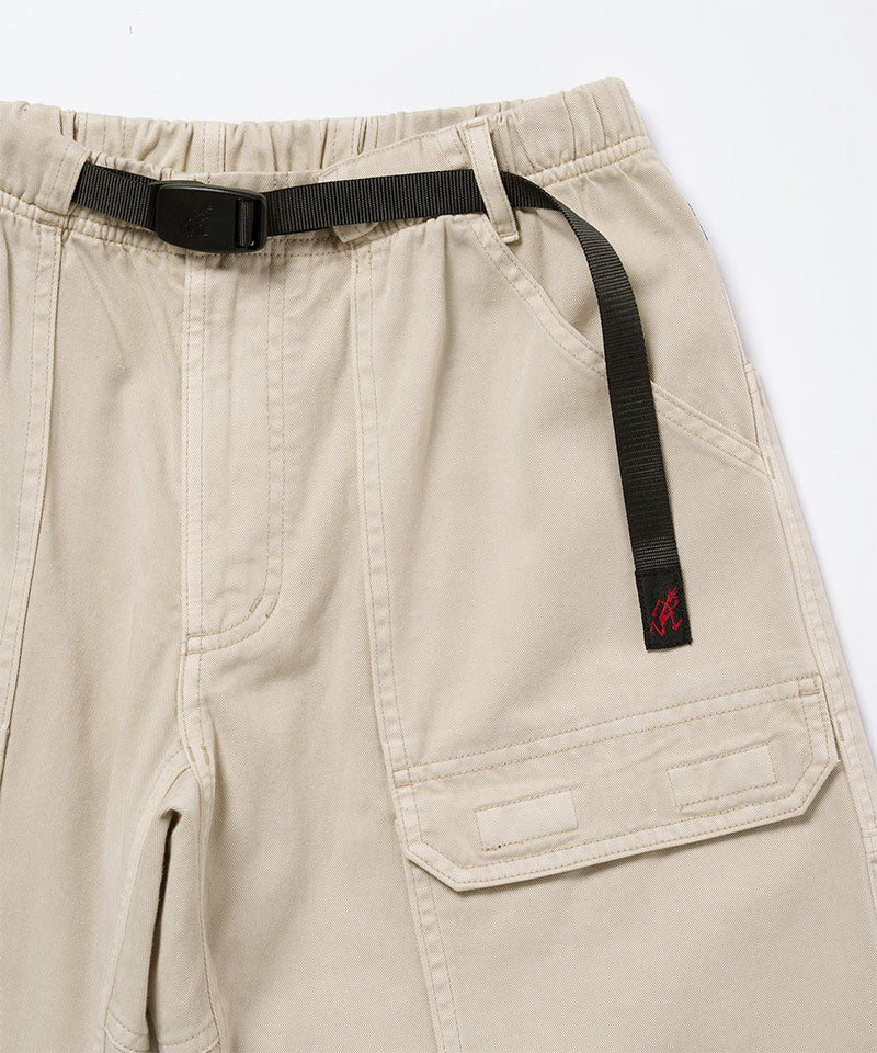 Close-up view of sand pigment Gramicci EQT Pant on a light-tone background.