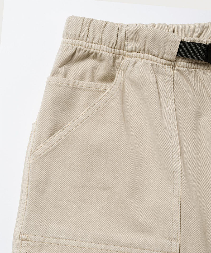 Close-up view of sand pigment Gramicci EQT Pant pocket detail on a light-tone background.