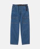 Light wash colored Gramicci Denim EQT Pant with a belt against a light-tone background.