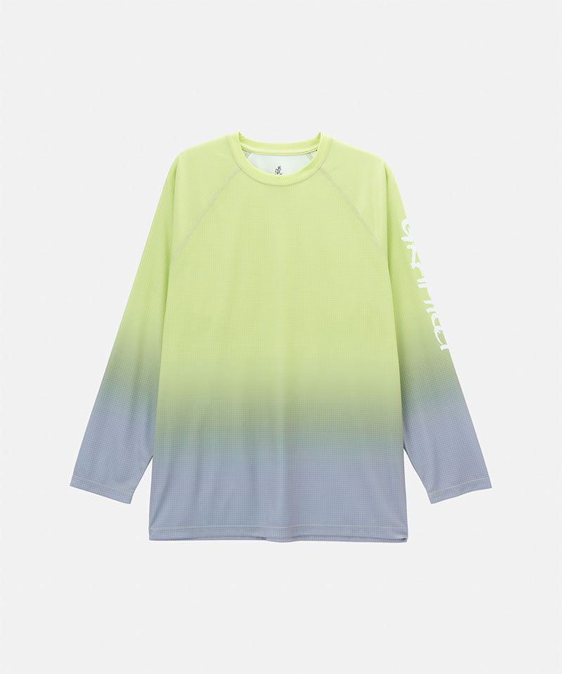 Gramicci yellow gradient UPF Shield S/S Top with a sleeve graphic against a light-tone background.
