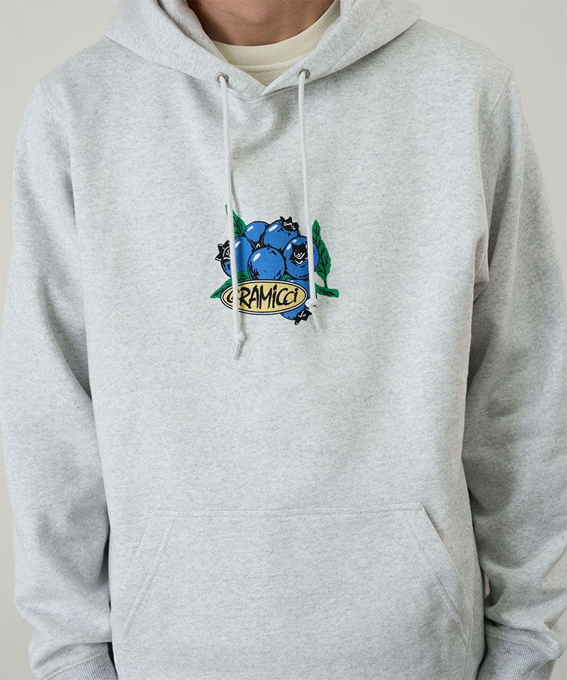Gramicci Blueberry Hooded Sweatshirt with blueberry graphic in heather ash worn by a model against a light tone background.
