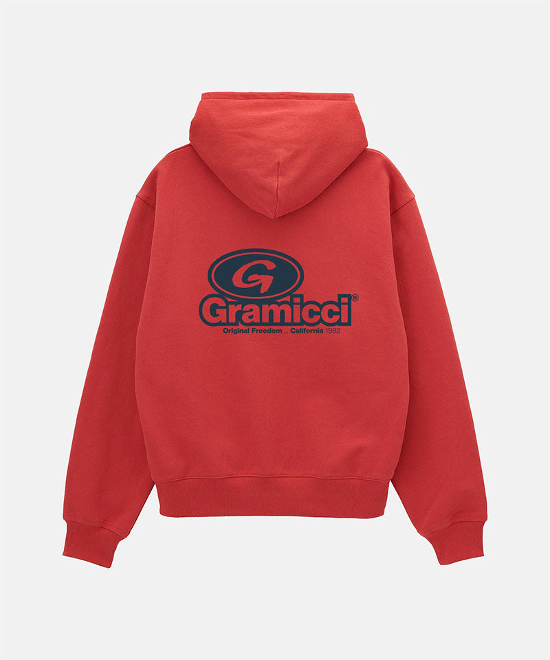Back view of a Gramicci crimson red '82 Zip Hooded Sweatshirt with a black graphic against a light-tone background.