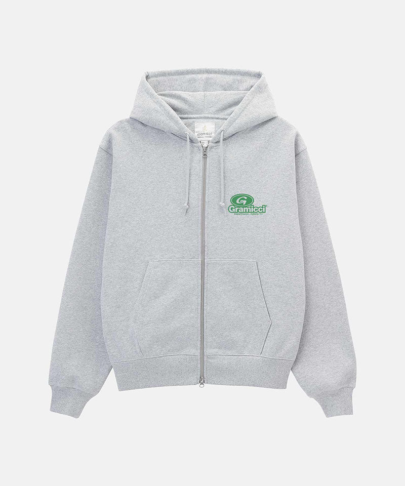Gramicci heather grey '82 Zip Hooded Sweatshirt with green graphic against a light tone background.

