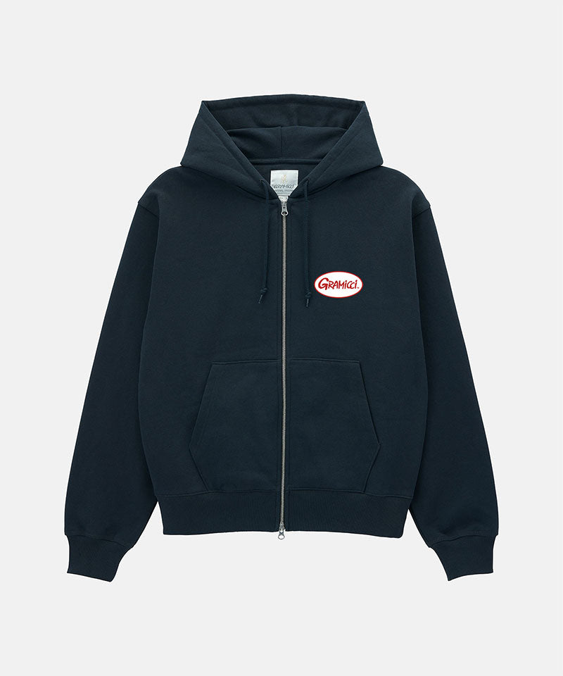 Gramicci vintage black Oval Patch Zip Hooded Sweatshirt with a red and white patch against a light-tone background.
