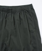 Close-up view of shadow colored Gramicci Swell Pant on a light-tone background.
