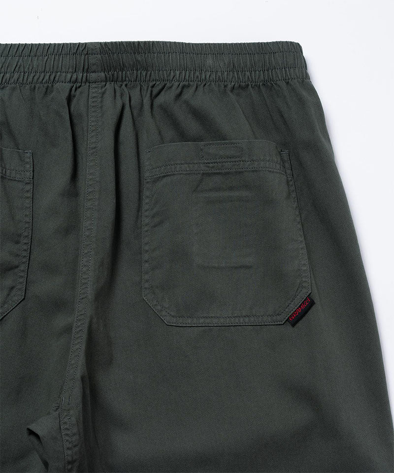 Close-up view of shadow colored Gramicci Swell Pant back pocket detail on a light-tone background.