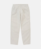 Stone colored Gramicci Swell Pant with a stretchy waistband against a light-tone background.
