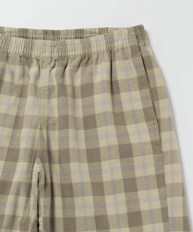 Close-up view of shadow plaid colored Gramicci Swell Short Shadow Plaid on a light-tone background.